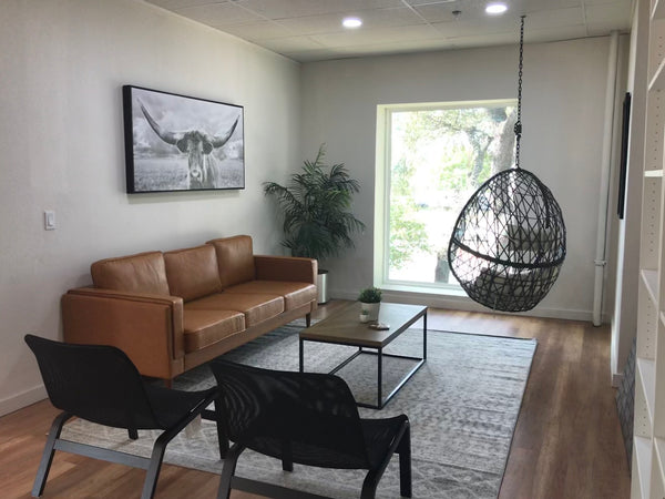 We purchase and move into a new office space/warehouse, giving it a complete redesign